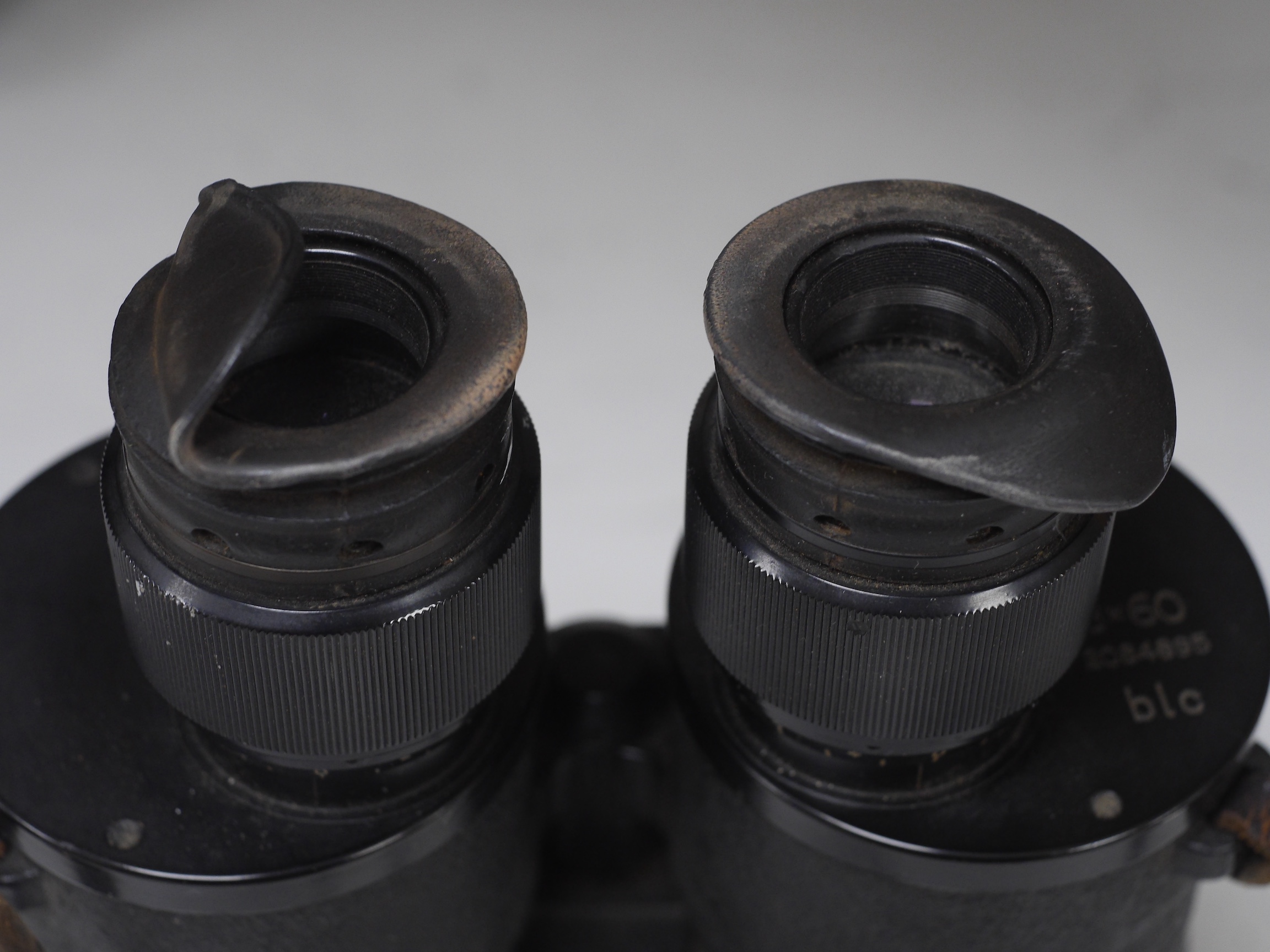 A pair of BLC 8x60 black binoculars, reg. 2084895, with a tripod fitment, 27.5cm log. Condition - fair to good